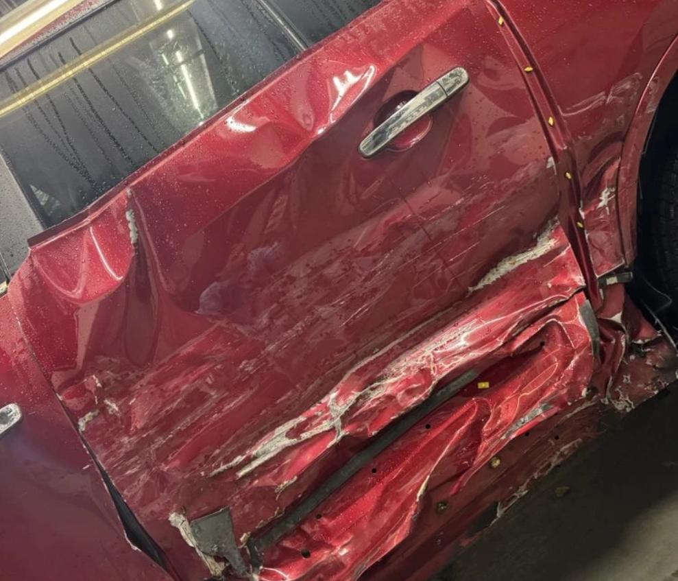 Buick Enclave side panel repair — before