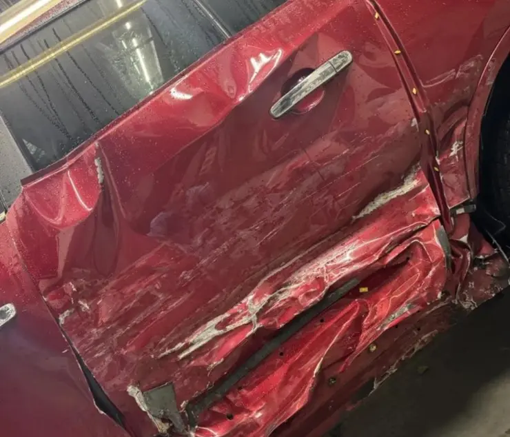Buick Enclave side panel repair — before